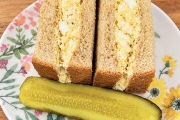 Tuna egg sandwich with creamy tuna, chopped boiled eggs, and mayonnaise served with bread.